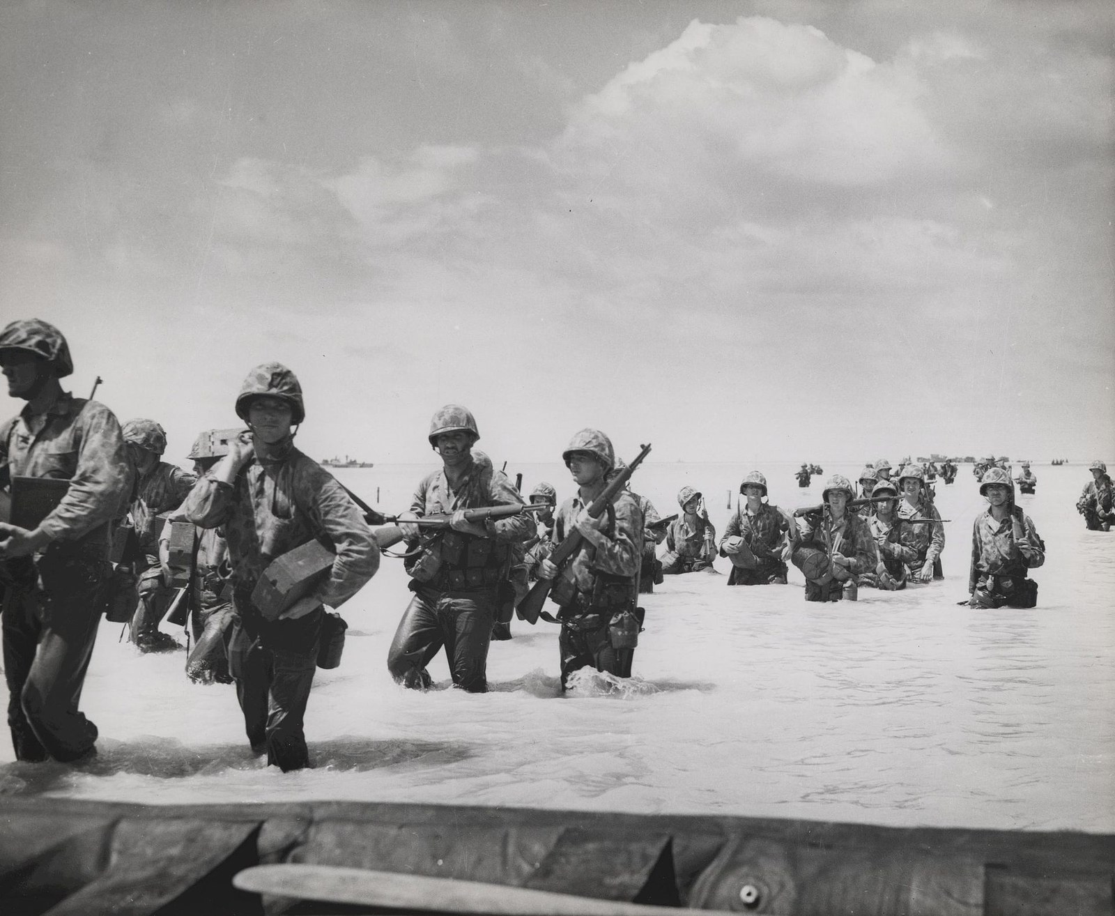 U.S. Marines moving through a Pacific battlefield